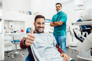 happy patient after a mouth sore treatment